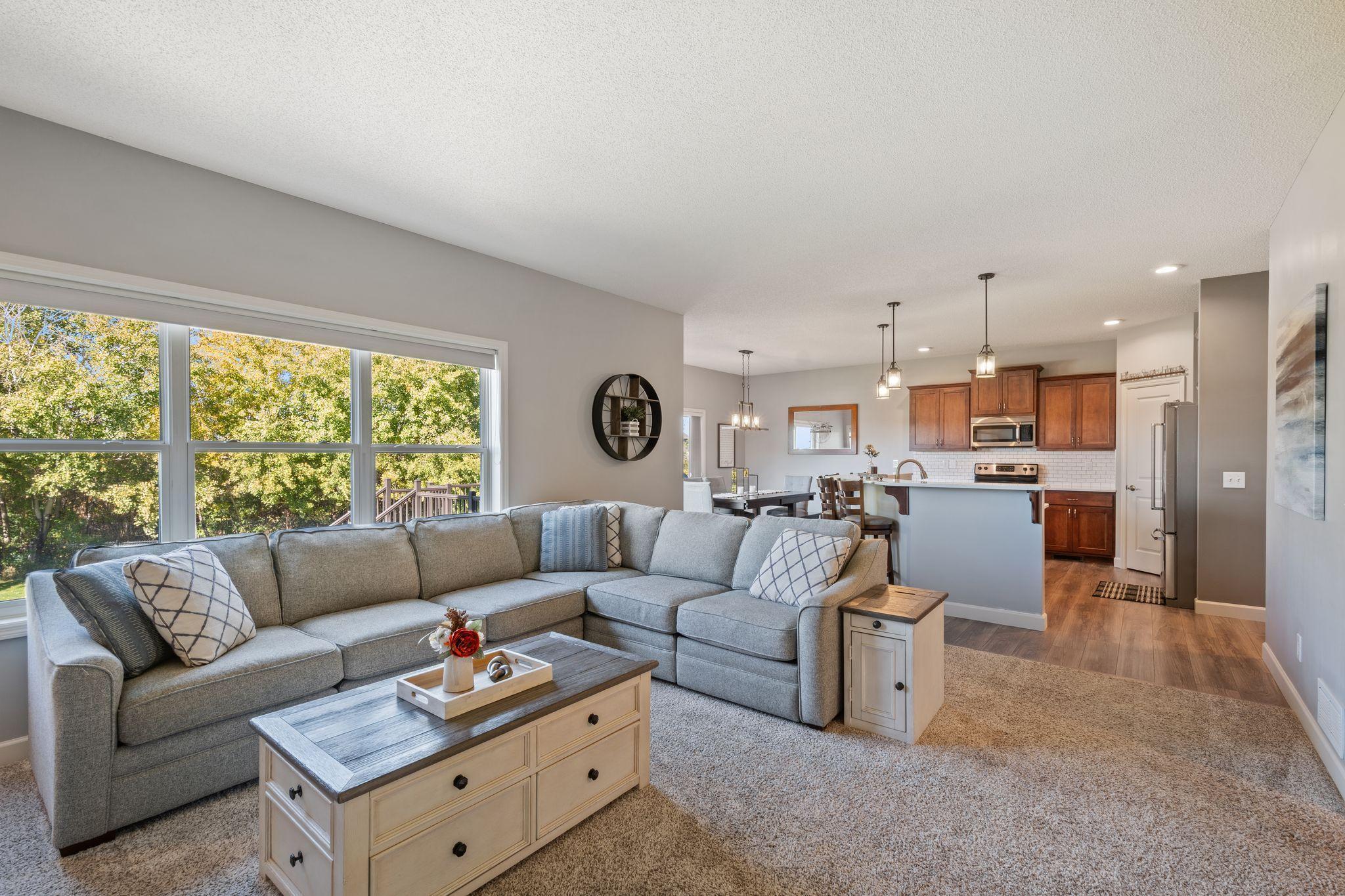 The open floor plan main floor flows from living room to kitchen to dining - all with incredible views!