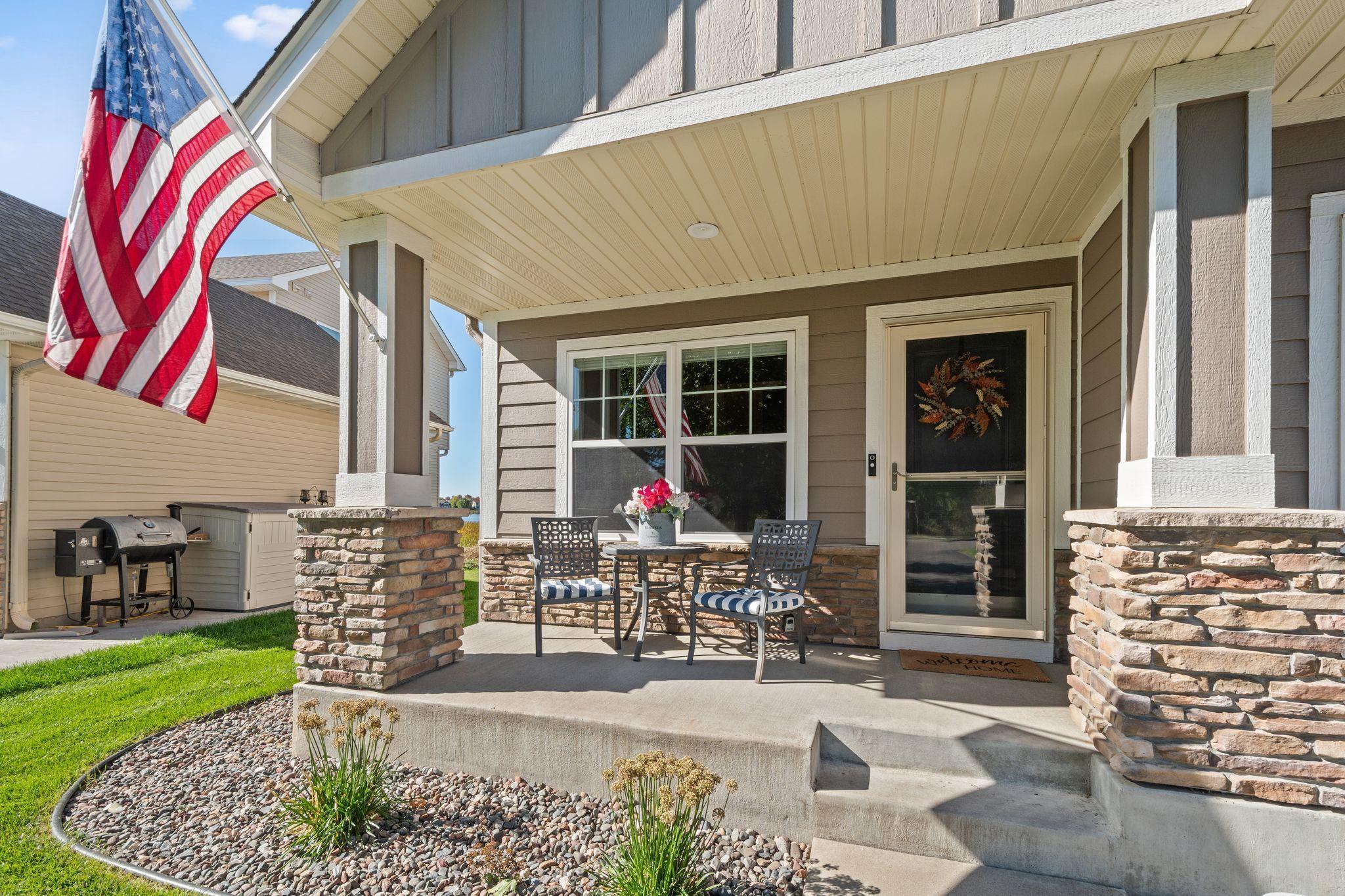 This adorable front porch welcomes family + friends.
