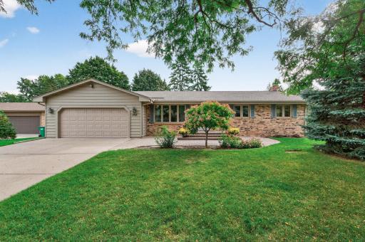 Charming & Classic Brick Rambler with beautiful paver patio & landscaping