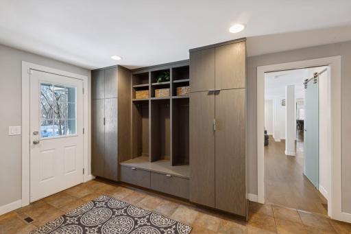 Spacious mudroom with build in storage and its own access door to the front yard.