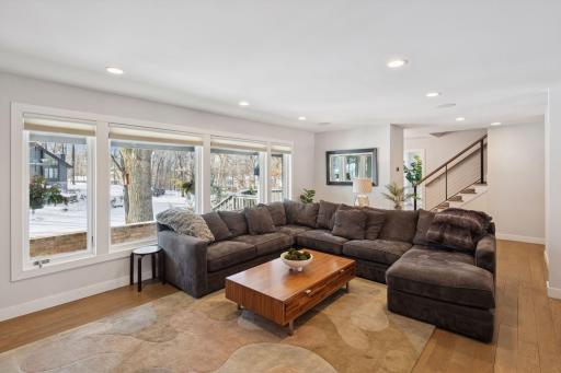 Main level living room with white oak floors.