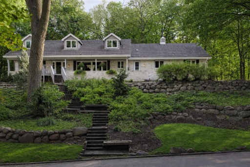 AI-enhanced image illustrating how the home could look with a whitewashed brick exterior