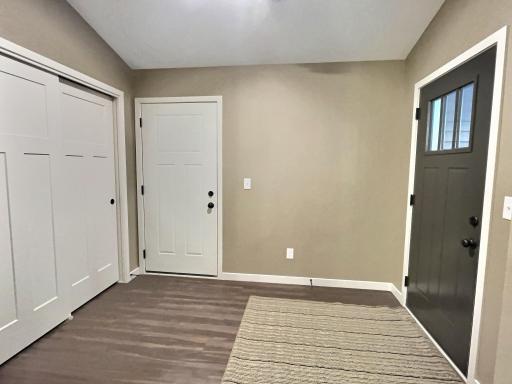 Plenty of space in the front entry to welcome your guests. Add a bench to sit down and put on your shoes. Photo is from a previous model.