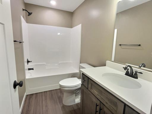 The main full bath is located just off the main part of the home and close to the 2nd bedroom. Photo is from a previous model.
