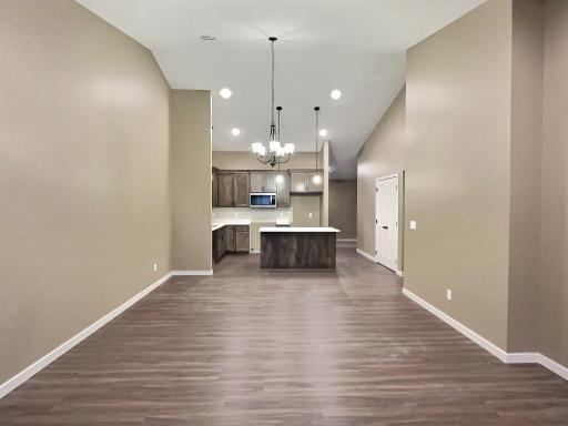 Dining room opens to the living and kitchen area creating a nice easy flow to the home. Photo is from a previous model.