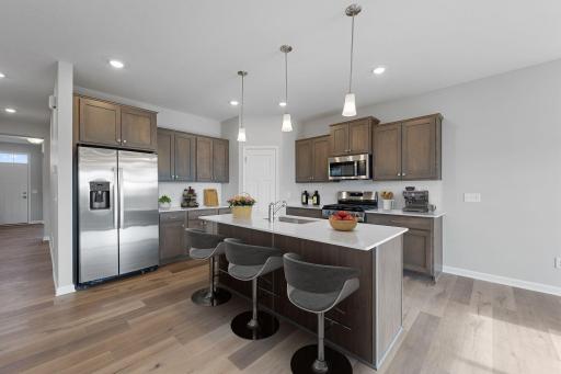 Well hello, Franklin Floorplan! Imagine yourself entertaining your family and friends at your spacious eat-in kitchen island. Beautiful and durable quartz countertops with GE appliances! (Home is virtually staged for representation only.)