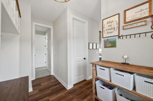 Entry way with a large closet and access directly to the main floor half bath