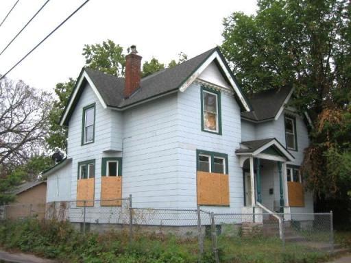1009 19th St. E. - solid duplex. Boarded for protection.