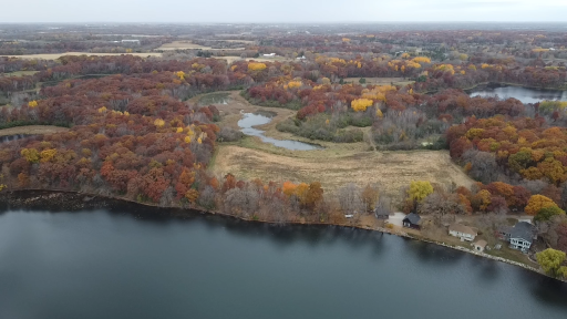 The lot at the lake is in the center of the photo here.