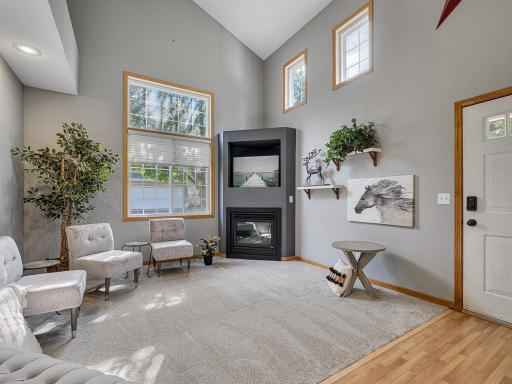 Living room with gas fireplace and vaulted ceilings!