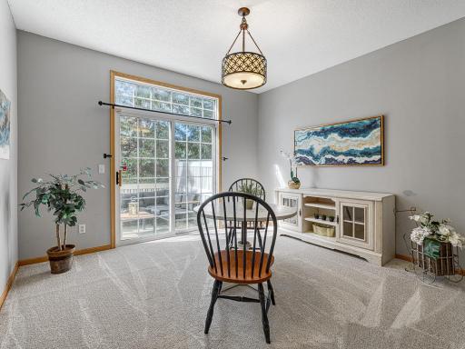 Large bright dining room with breakfast bar.