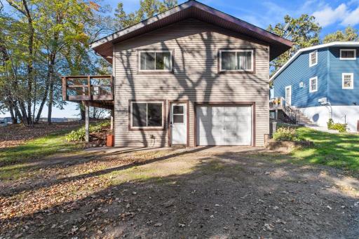 Street side with tuck under garage and lower level bonus room