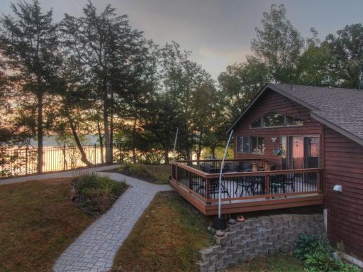 This beautiful lakeside setting offers a spacious deck to take in the sunrise over Lake Francis or follow the paver pathway down to the lake and start your day with the beauty of the tranquil waters of Lake Francis.