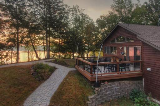 This beautiful lakeside setting offers a spacious deck to take in the sunrise over Lake Francis or follow the paver pathway down to the lake and start your day with the beauty of the tranquil waters of Lake Francis.