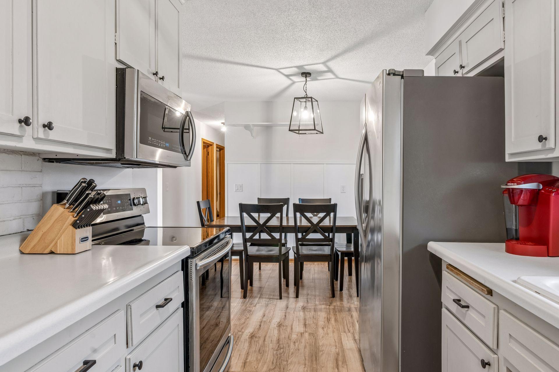 Updated kitchen appliances including an osmosis water filter system.