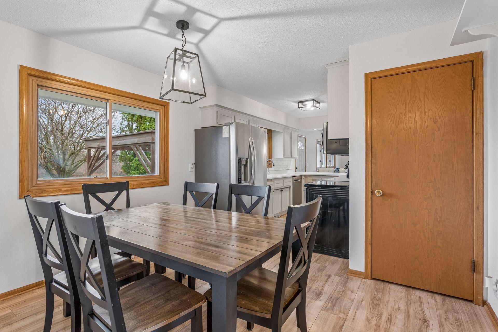 Spacious dining space for easy family dinners and also overlooks the backyard. Adjacent closet pantry.