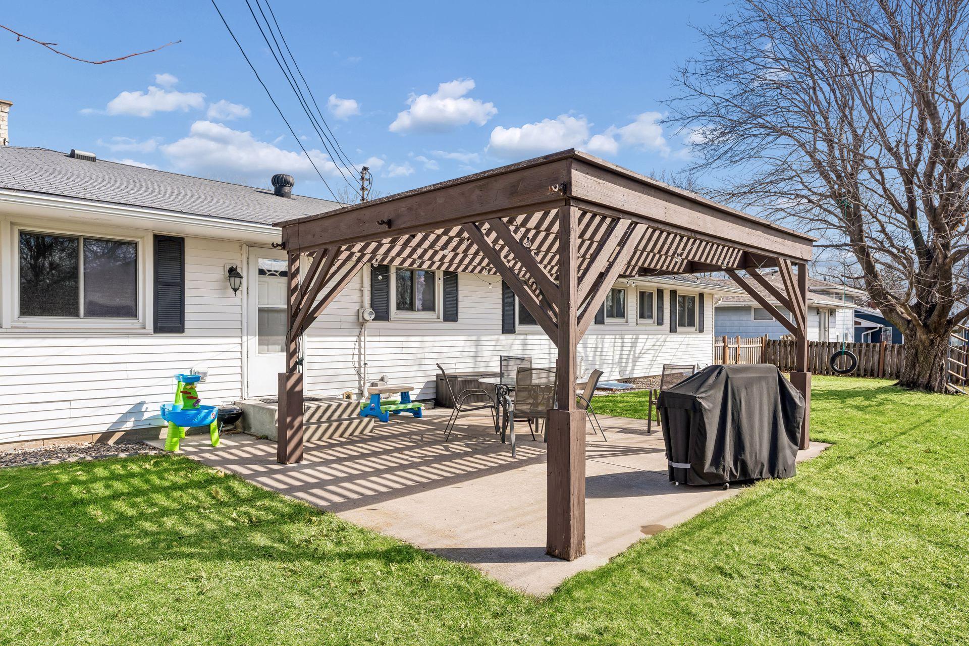 Relax on the concrete patio with pergola.