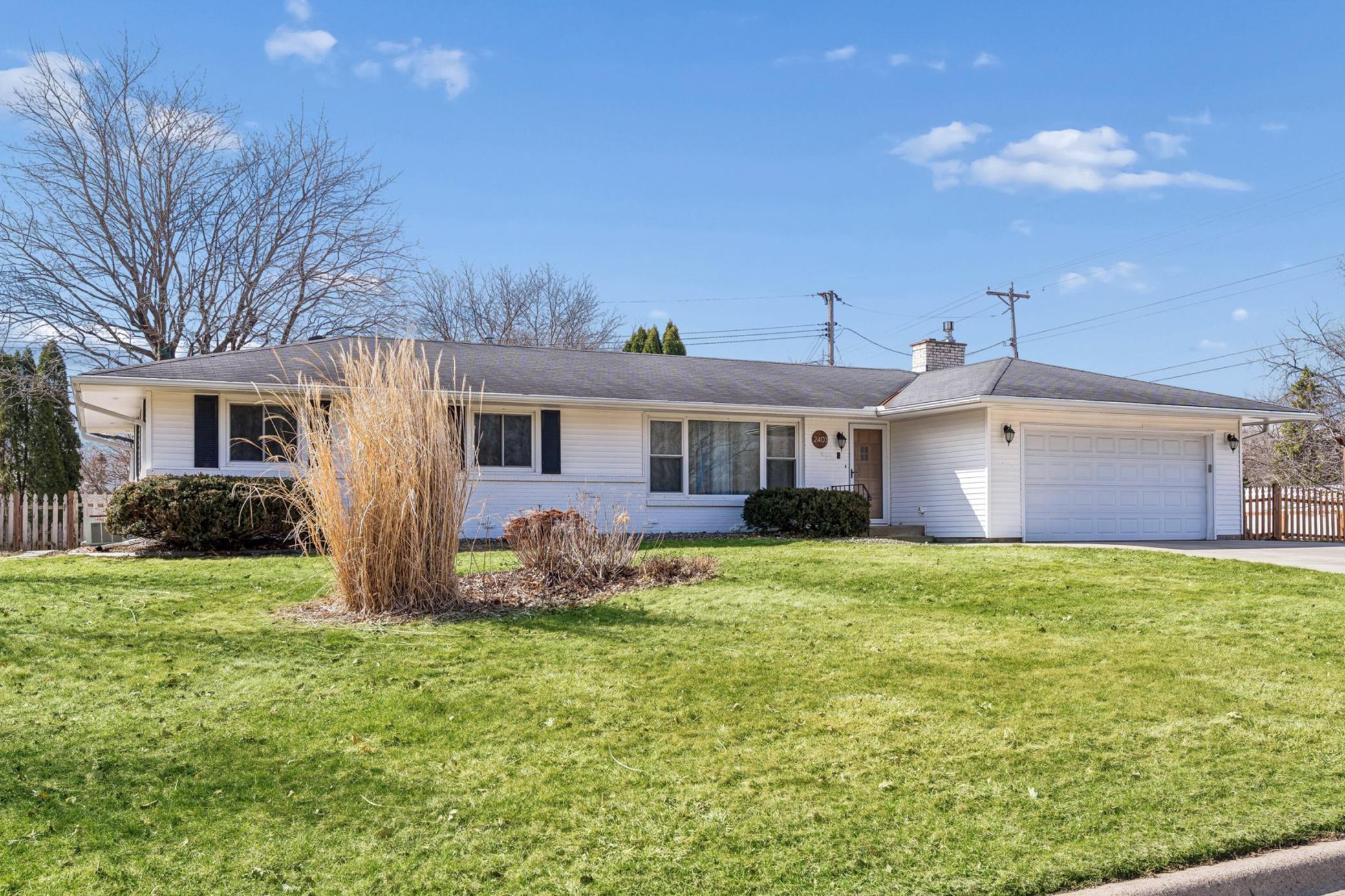 Fabulous updated rambler on a beautifully maintained lot with large front and back yards.