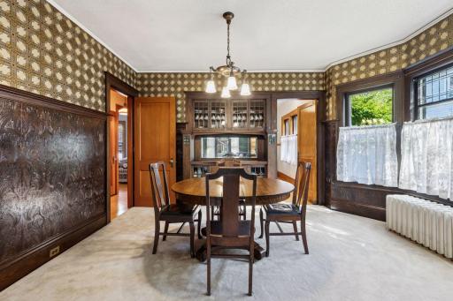 You'll want to have a dinner party in this dining room! Fabulous wallpaper that enhances original built-in.