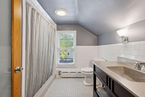 A gorgeous 3/4 bath with a walk in tiled shower.