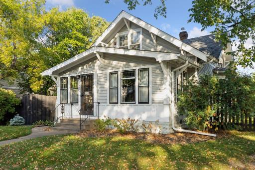 3233 Cedar Avenue South located on a 100 foot wide lot surrounded by a wood privacy fence. NEW ROOF 2023