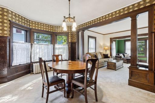 Open floor plans were popular in 1914 also. Sightlines from the dining room to the living room to the sunroom & foyer.