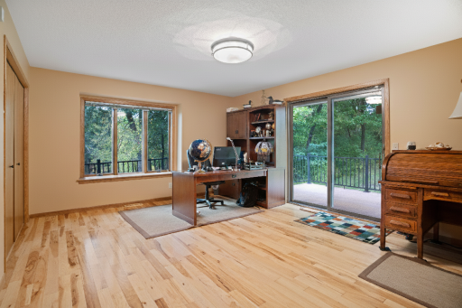 Large main level bedroom currently used as an office overlooks one of 3 ponds.