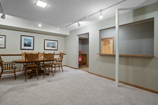 Another view of this large versatile space including wet bar for all your entertainment needs.