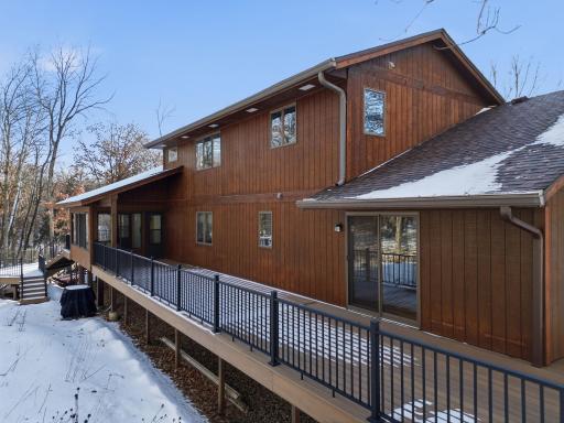 Huge 2nd deck connects to both the 3 season porch and the large main level bedroom. Bonus: there is a ramp from the front of the home to this deck - a perfect private entrance if you have a client-facing home business.