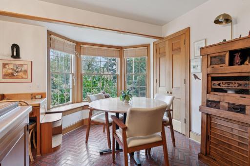 Window bench seats in kitchen add extra storage space