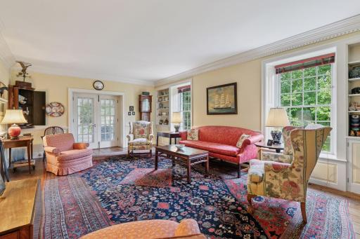The living room is exceptional, bathed in natural light