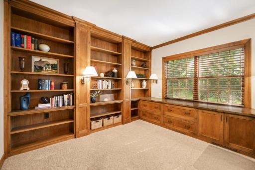Warm wood built-ins bring character and distinction to the private office