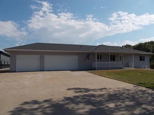 Front View of Ranch Style One Level with 3 Car Attached garage