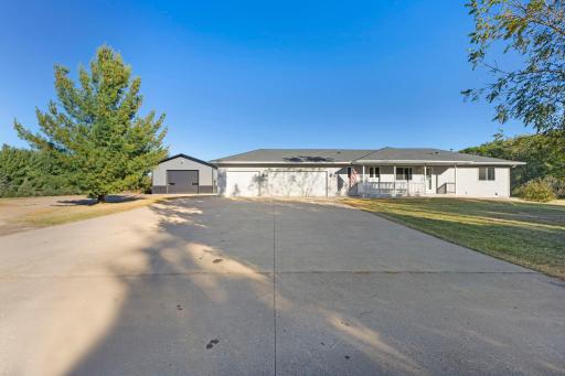 Front of Home with Huge Cement Driveway and 3 car Garage
