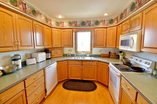 Well appointed kitchen with plenty of cupboards and counter tops
