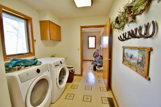 Main floor laundry right off the kitchen and dining area