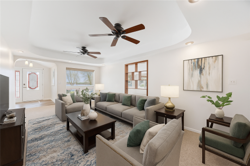 Great living space with views of the Lake and overhead fans. This room has been virtually staged.