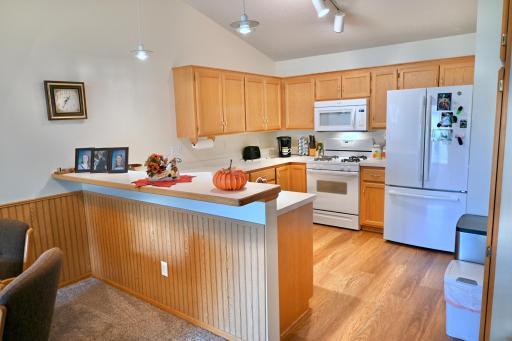 New kitchen flooring, plenty of kitchen cabinets. Add stools for additional seating.