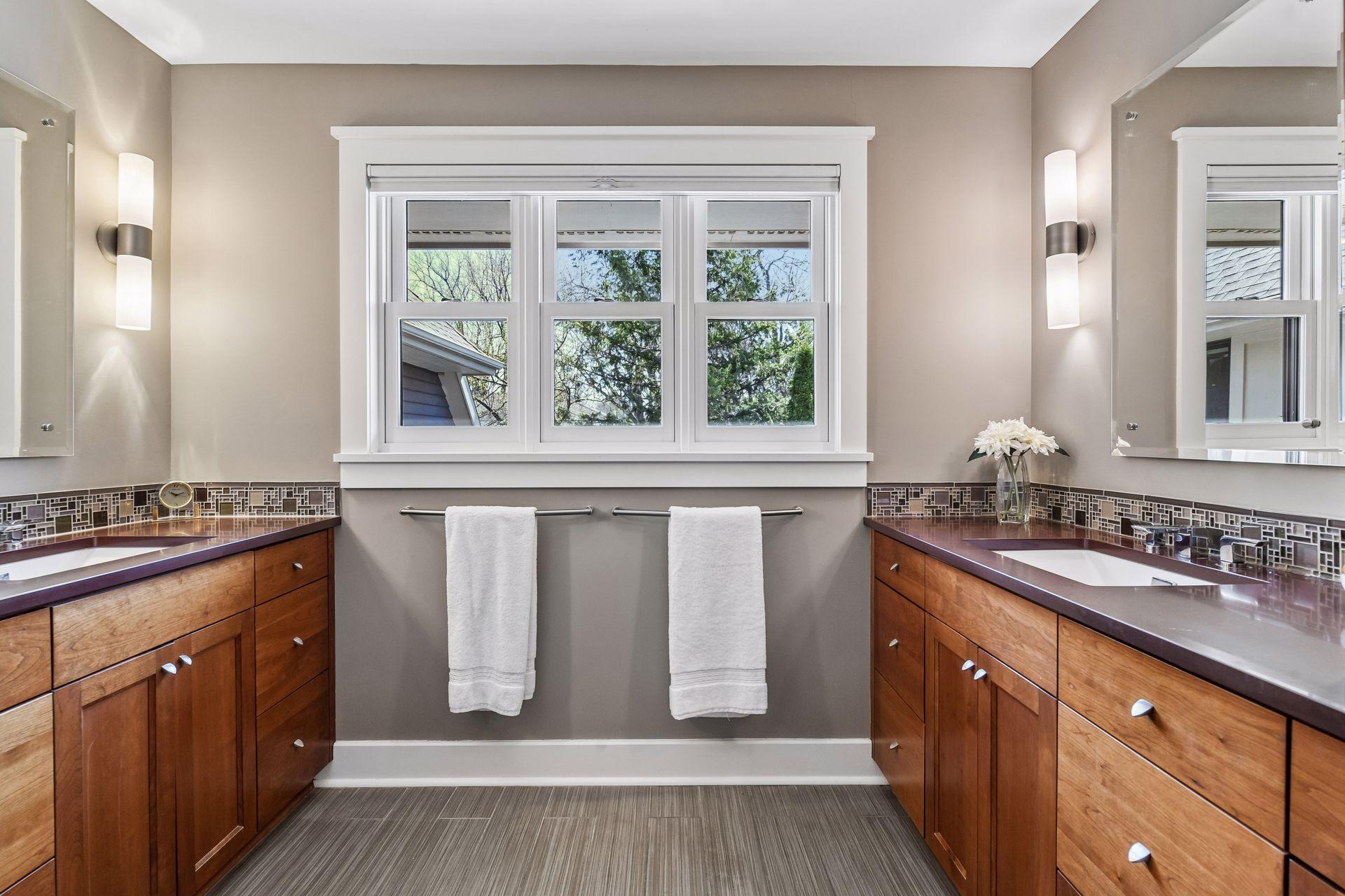Primary bath with separate sinks and storage
