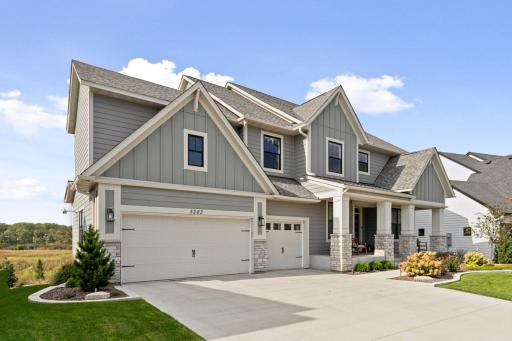 The front of the home showcases charming curb appeal, with inviting architecture and well-tended landscaping that create a warm and welcoming first impression