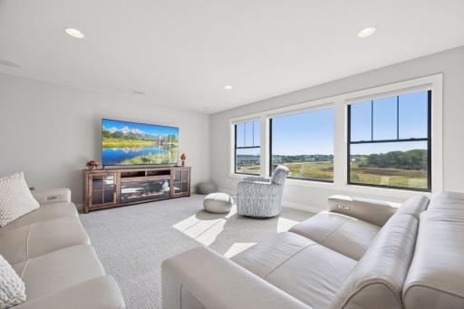 The bonus room showcases even more sweeping views of the wetlands