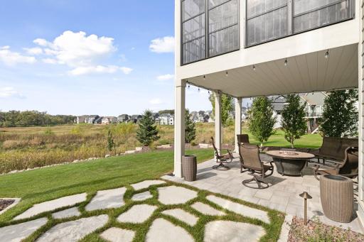 The exterior entertaining areas are beautifully landscaped and feature multiple gathering spaces perfect for outdoor enjoyment