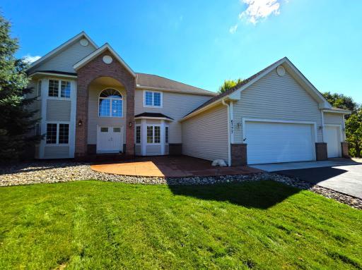 Welcome to 6777 Primrose Ct! This beautiful two-story home has striking brick accents, a welcoming double-door entry, and a spacious three-car garage.