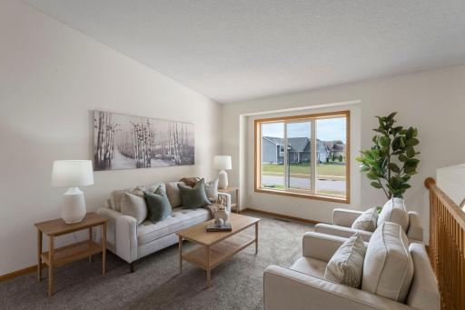Nice large window with plenty of natural lighting. Living room updates include: Freshly painted, brand new carpet, new light fixture in the foyer
