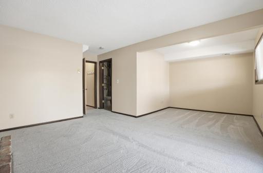 Family Room with door to lower level bathroom/utilities
