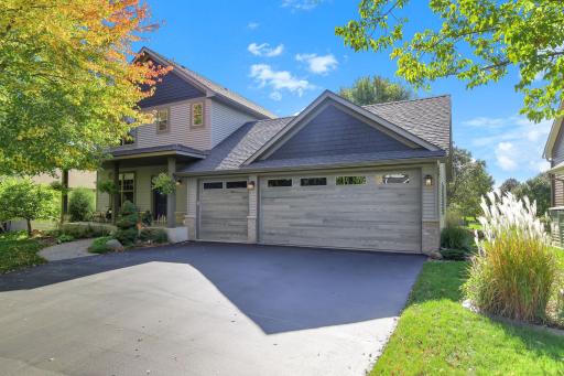 Stately two-story with covered front porch and 3-car garage.