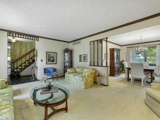 Views of foyer, dining room and living room.