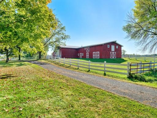 New barn with 5 horse stalls, tack room, hayloft and vehicle storage, may be able to have a horse arena in there as well.