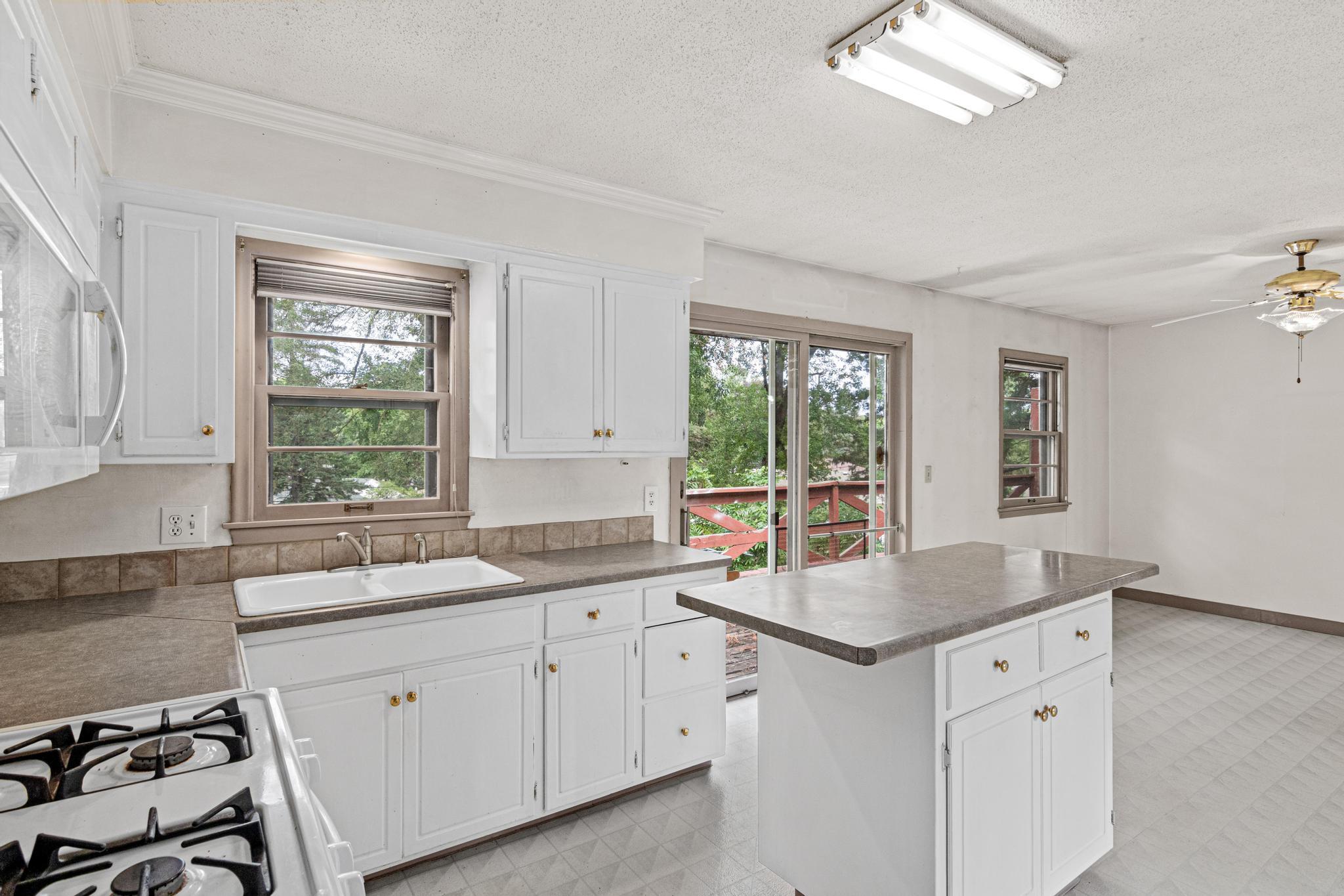 Kitchen and eat-in dining space with sliding glass door leading out back!