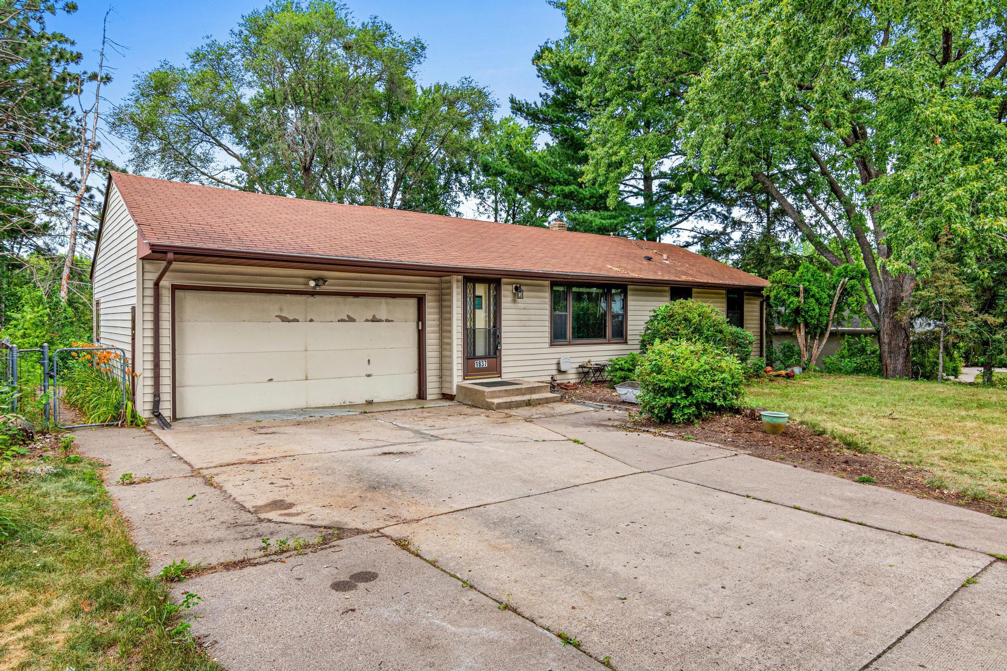 Concrete driveway and 2-car garage!